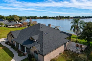 A lakefront Central Florida home with a roof installed by Titan Roofing